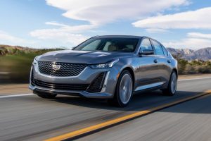 A silver 2022 Cadillac CT5 driving on the road.