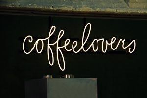 A neon sign that says "coffee lovers".