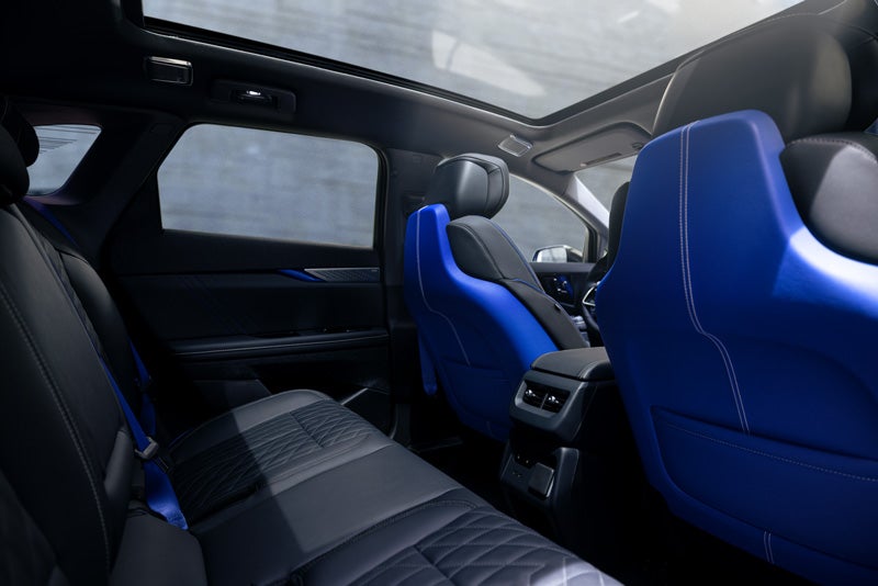 Back Seat View of the 2026 OPTIQ-V Blue Front Seats, Sun Roof, and Interior | Earnhardt Cadillac in Scottsdale AZ